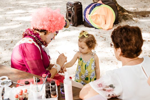Accueil Vibrant outdoor scene with a colorful clown painting a child's face at a lively party.